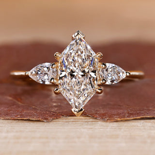 Dutch marquise diamond ring pear side stones three stone.