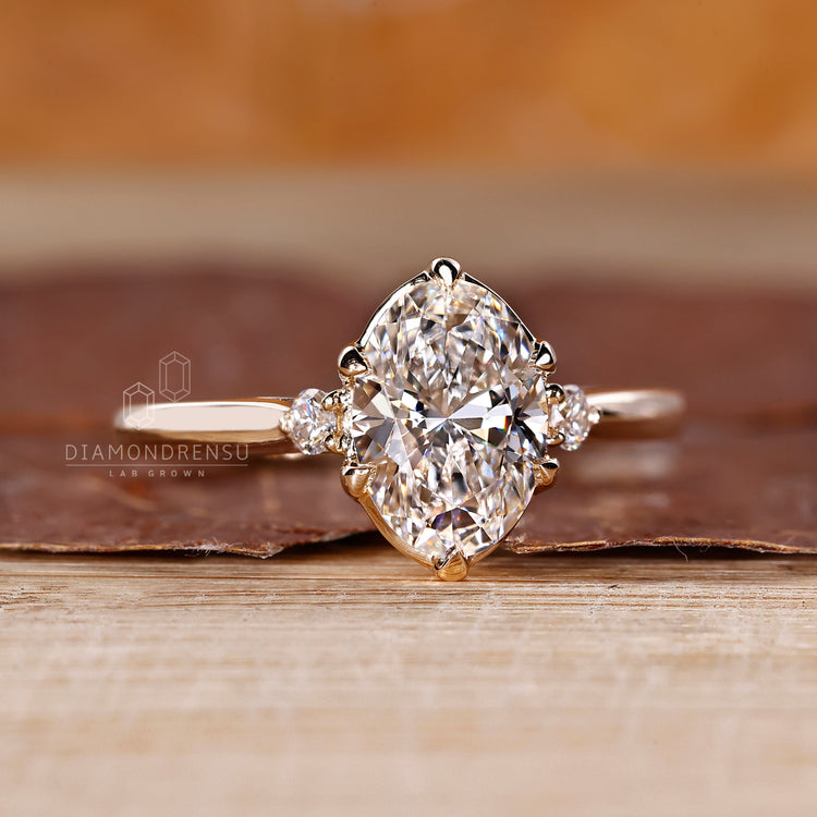 Lab grown oval diamond ring three stone style.