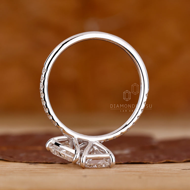 Toi et moi ring pear radiant diamond pave style.