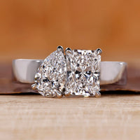 Toi et Moi diamond ring with radiant and pear cut diamonds.