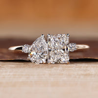 Pear and radiant cut ring toi et moi split shank style.