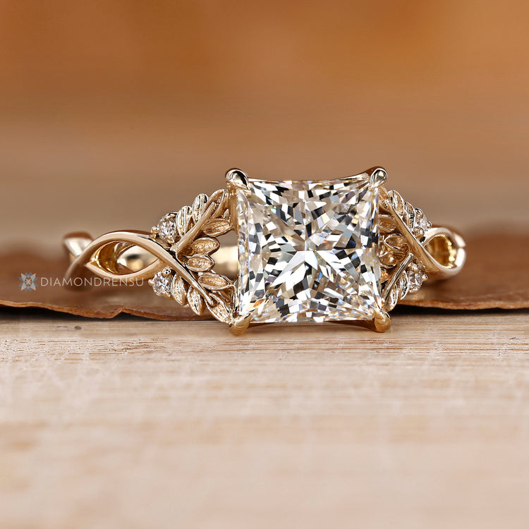 Princess diamond ring with round cut side diamonds.