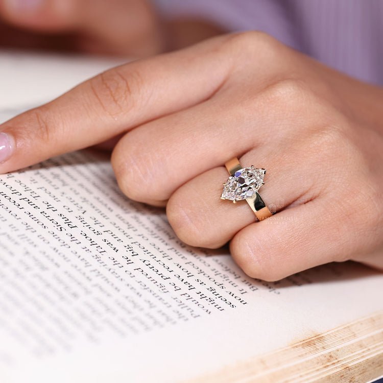 Lab grown solitaire marquise diamond ring design.