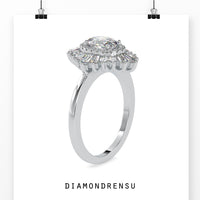 Oval diamond engagement ring with a vintage-inspired cluster setting.