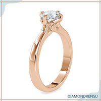 4 prong engagement ring with a round cut diamond center.