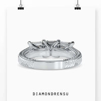 Three stone emerald cut diamond ring in 3 stone trellis ring setting.