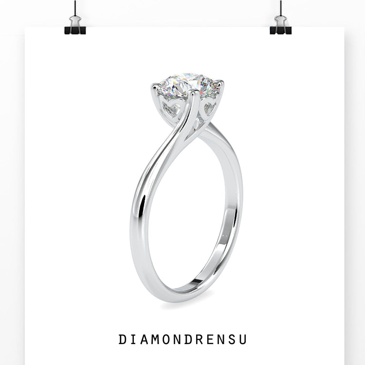 Round brilliant cut diamond ring with a chic bypass setting.
