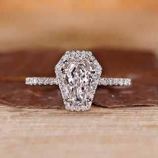 Coffin cut diamond ring halo pave round diamond style.