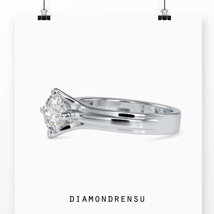Diamond solitaire ring round with timeless simplicity and elegance.