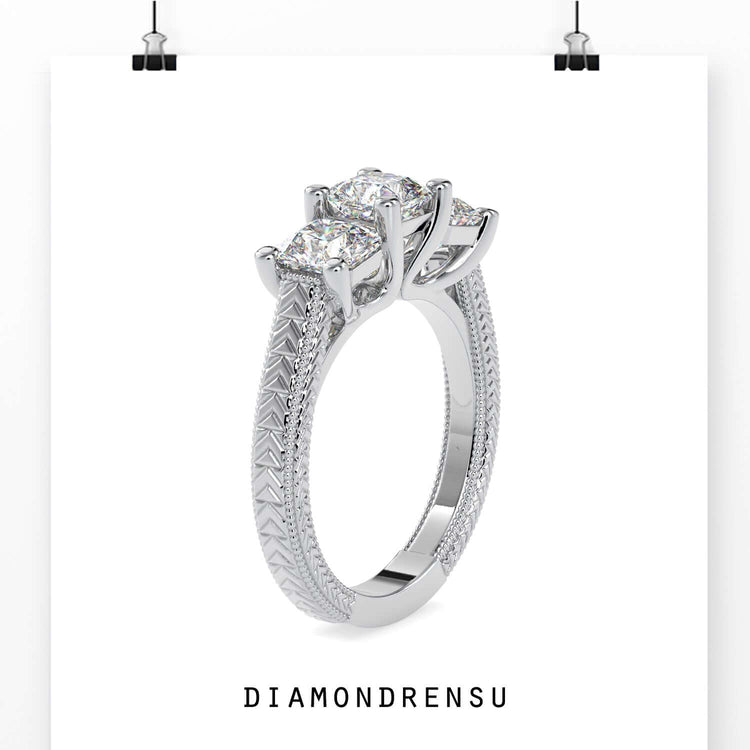 Lab grown diamond three stone engagement ring with trellis setting.