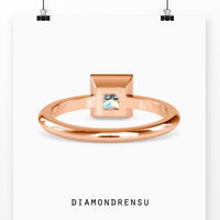 Stunning engagement rings with princess cut diamonds and a bezel setting.