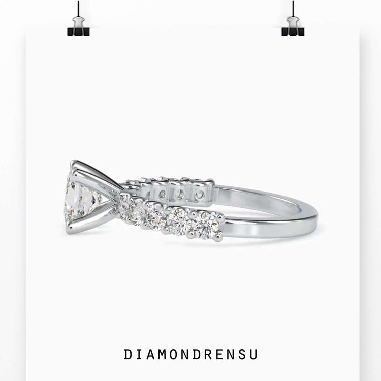 Modern prong setting ring with a princess cut diamond and pave accents.