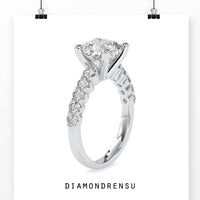 Halo diamond ring featuring an oval diamond in 4 prong engagement ring