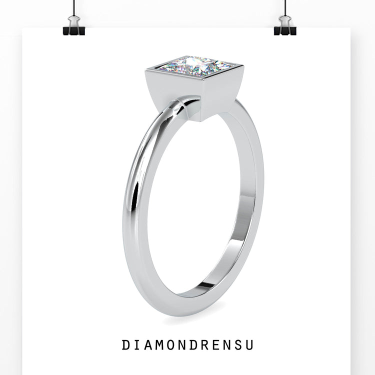 Stunning bezel princess cut diamond ring with an IGI certified diamond.