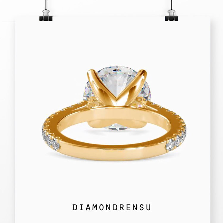 Lab grown diamond engagement ring with a round brilliant cut diamond in a cathedral setting ring.