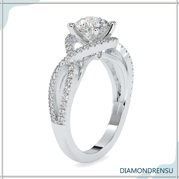 IGI certified round cut diamond ring featuring a twisted engagement ring design.