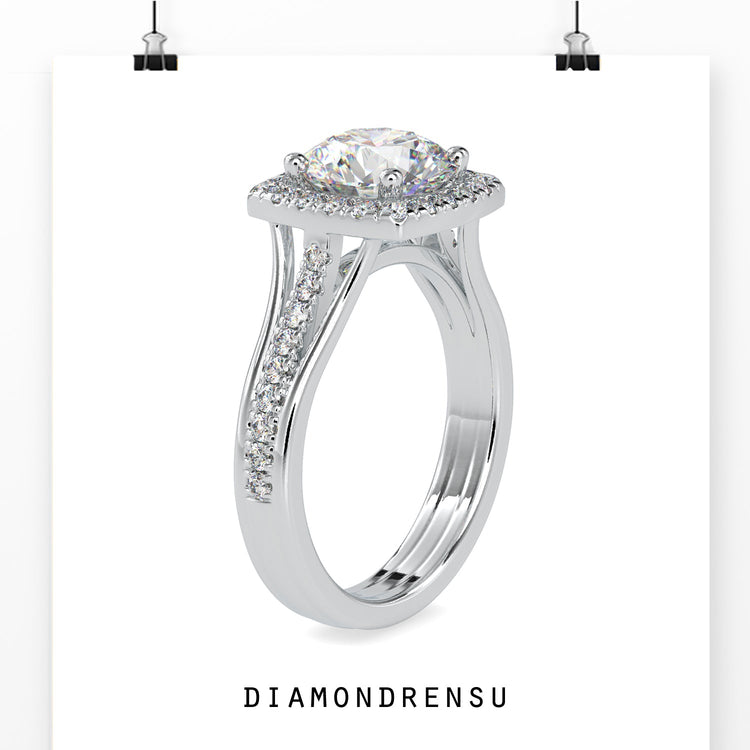 Round brilliant diamond ring with a split shank engagement style.