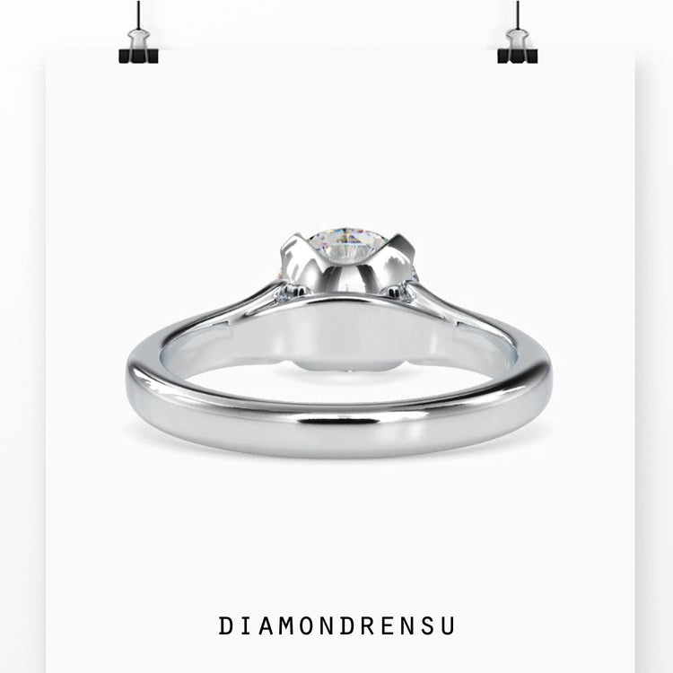 Round brilliant diamond ring with a secure prong setting.