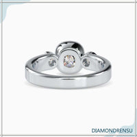 Three stone emerald cut diamond ring in yellow gold, a stunning vintage-inspired piece.
