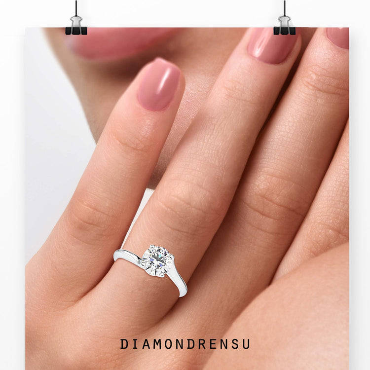 2 carat round cut diamond ring with a beautiful bypass ring setting.