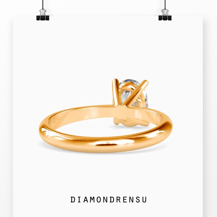 Yellow gold oval solitaire engagement ring for a classic, radiant look.