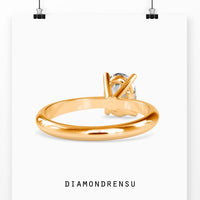 Yellow gold oval solitaire engagement ring for a classic, radiant look.