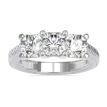 Three stone engagement ring diamond with radiant cut in prong setting.