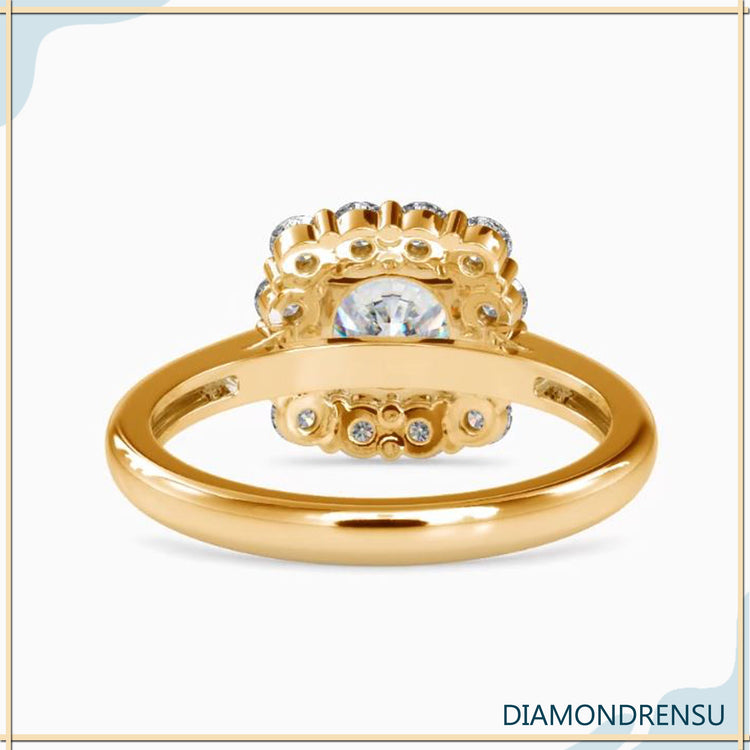 Handmade jewelry with a round brilliant cut halo engagement ring.