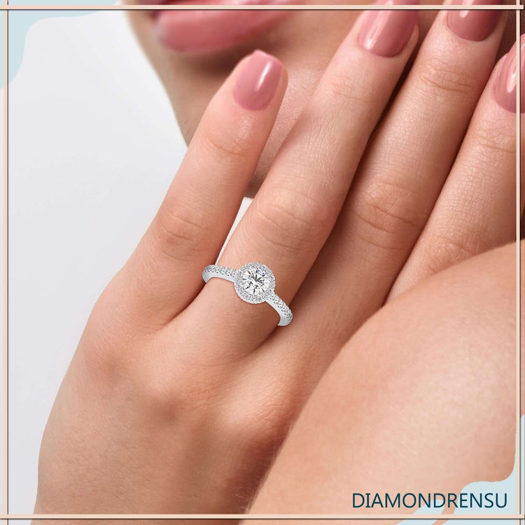 Cathedral ring setting featuring a beautiful round brilliant cut diamond.