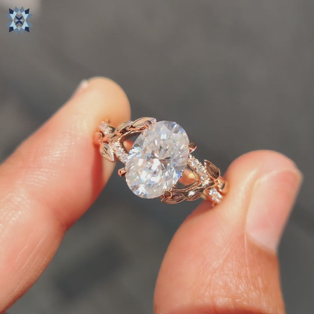 Nature inspired oval engagement ring enhances hidden halo ring details.