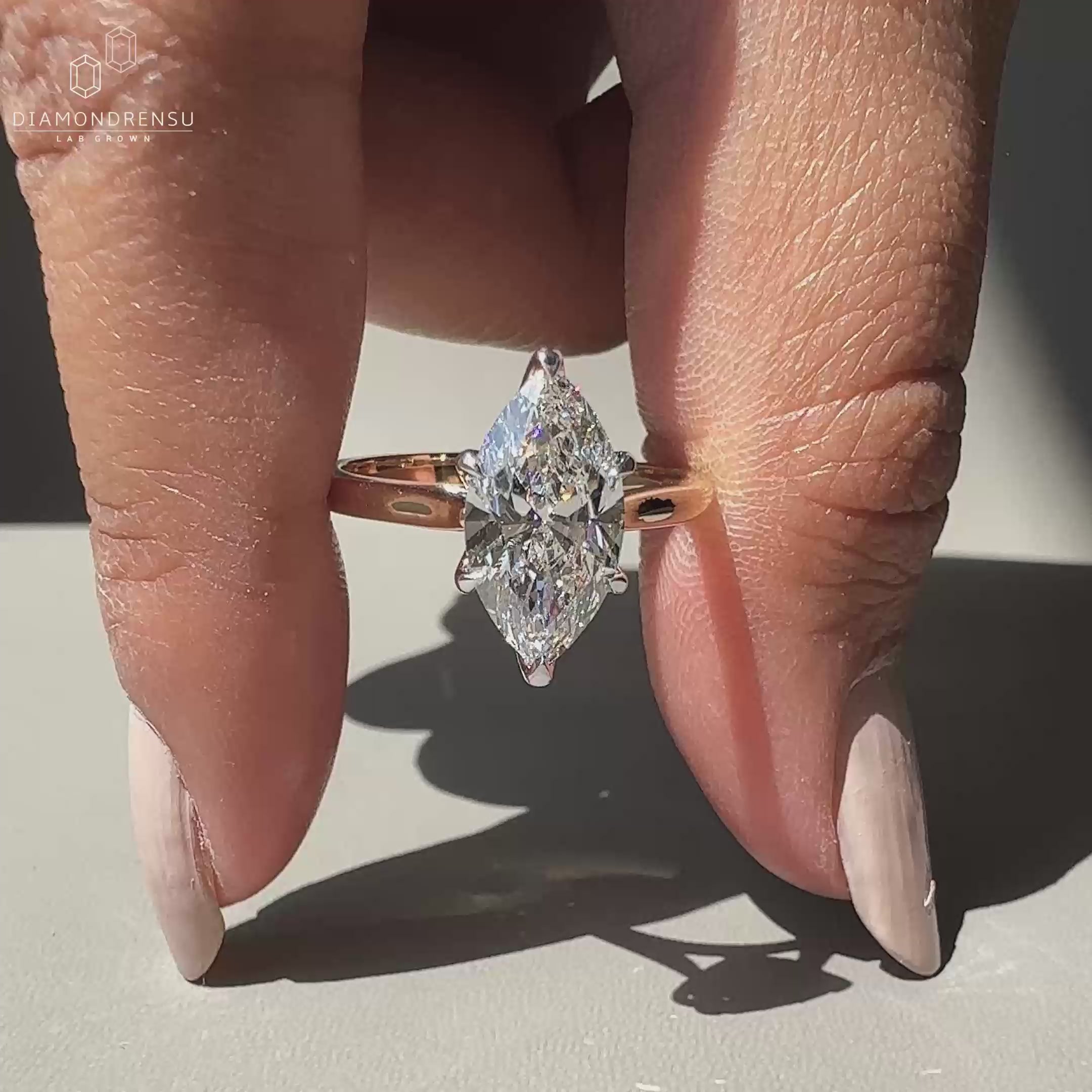 Stunning marquise diamond engagement ring with delicate details.