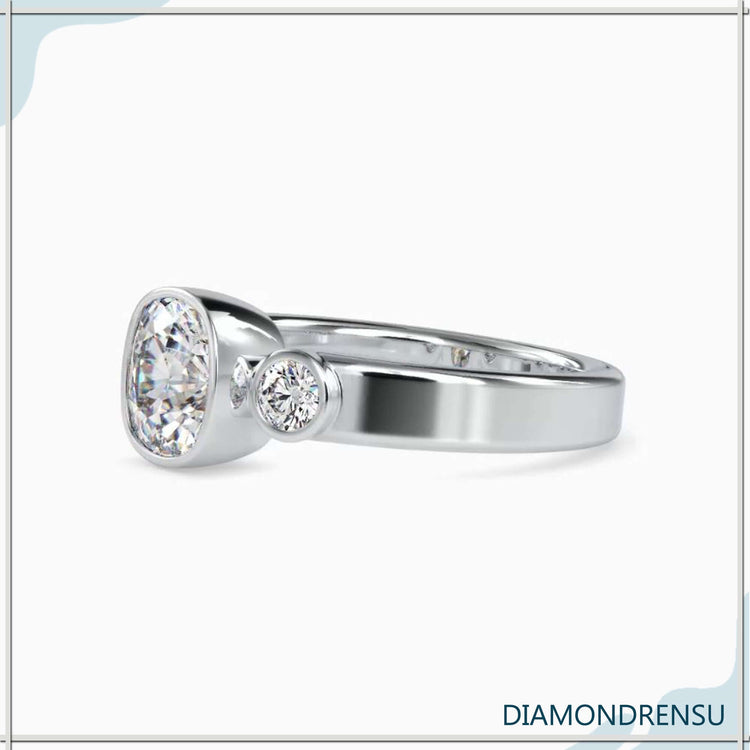 Three stone diamond engagement ring with a cushion cut center stone and IGI certified diamonds.