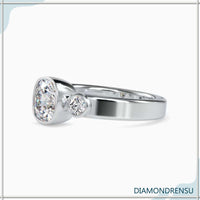 Three stone diamond engagement ring with a cushion cut center stone and IGI certified diamonds.