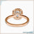 Halo diamond engagement ring with a radiant cushion cut diamond.