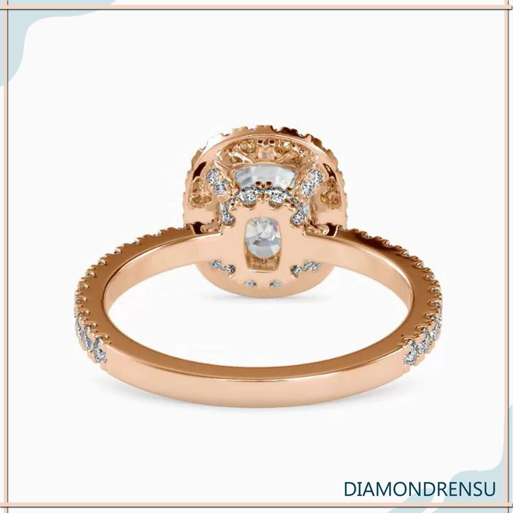Halo diamond engagement ring with a radiant cushion cut diamond.