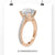 Cathedral setting engagement ring with a 2 carat round brilliant cut diamond and pave ring accents.