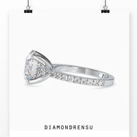 Pave engagement ring with a round cut diamond in a rose gold, white gold, or yellow gold ring.