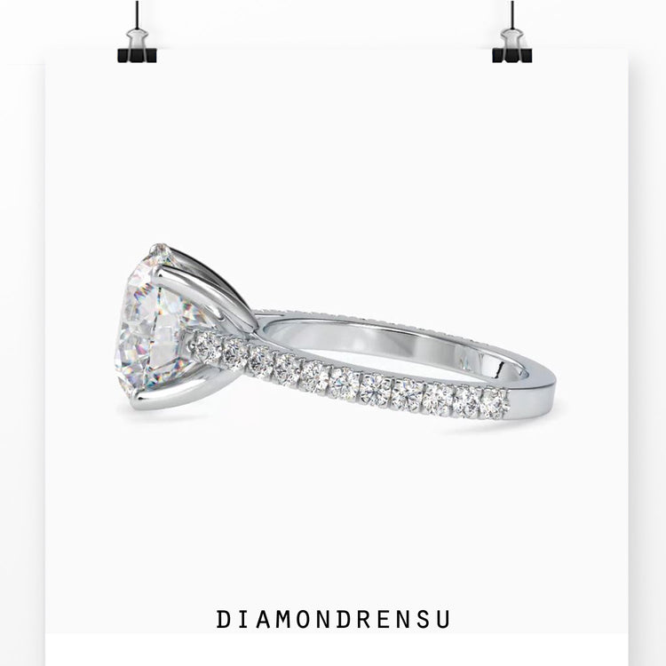 Pave engagement ring with a round cut diamond in a rose gold, white gold, or yellow gold ring.