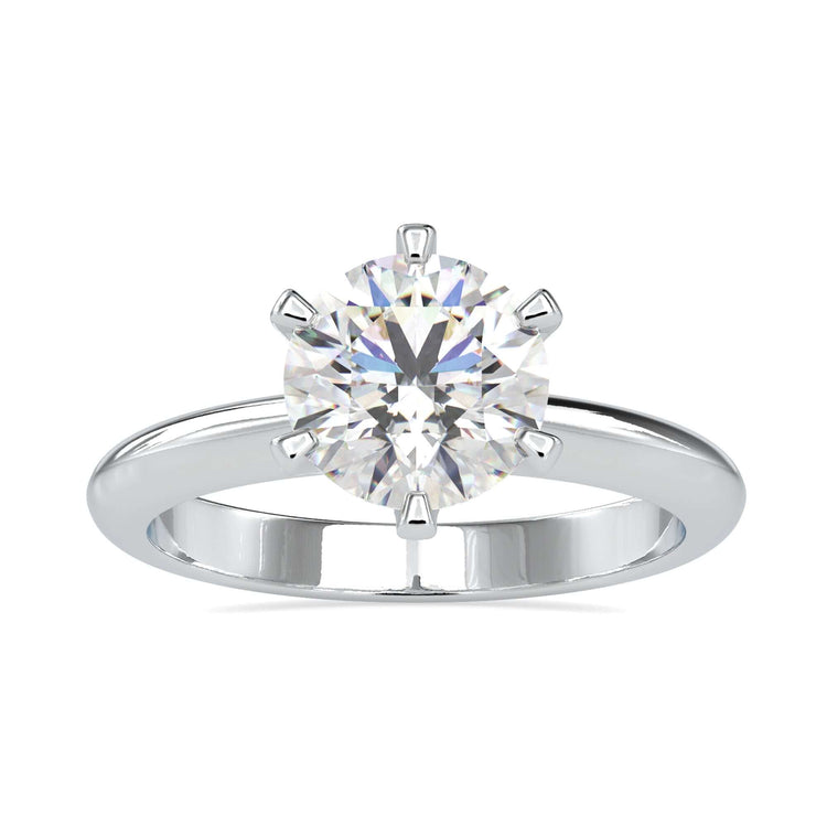 Round solitaire ring offering simplicity and timeless elegance.