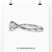 Solitaire engagement ring with a radiant round brilliant diamond.