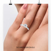 2 carat round cut diamond ring set in a timeless prong setting.