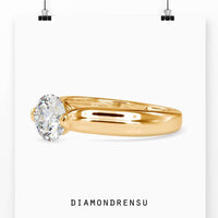 Tension set diamond with round solitaire engagement style.