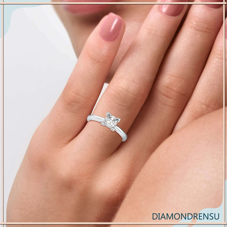 Beautiful ring with princess cut diamond and a cathedral style ring setting.