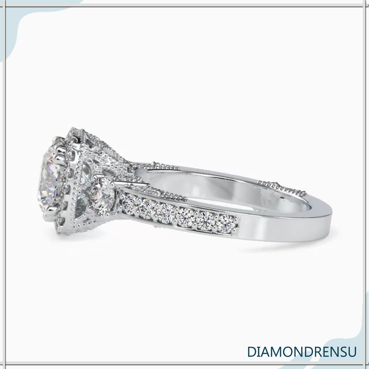 Round cut diamond ring in a classic vintage gold setting.