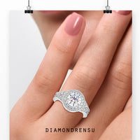 Round cut diamond engagement ring showcasing a sleek and modern style.