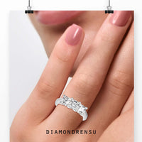 Designer three stone diamond ring in rose gold.