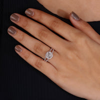 Woman's hand gracefully showcasing the vintage rose gold engagement ring