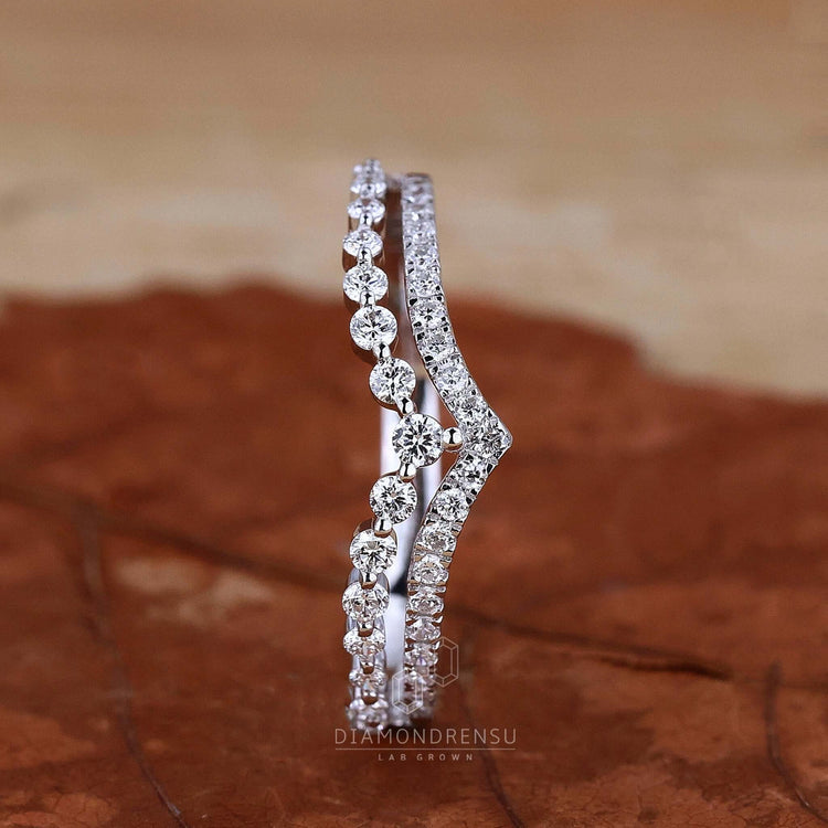 Hand displaying a Lab Grown Diamond Wedding Band