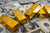 A picture of gold bars and money under it.