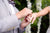 A man setting an amazing ring on his fiancée's finger